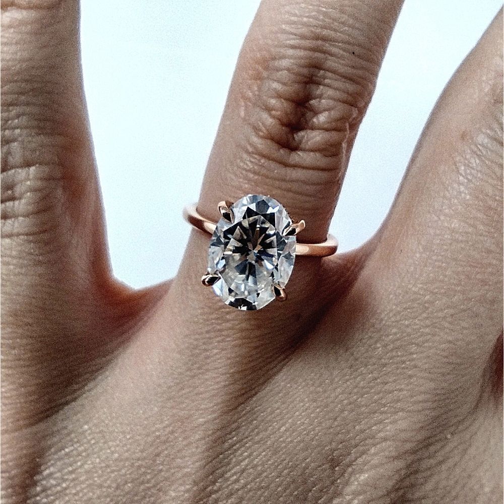 Classic Rose Gold Oval Solitaire Ring with Clear Stone